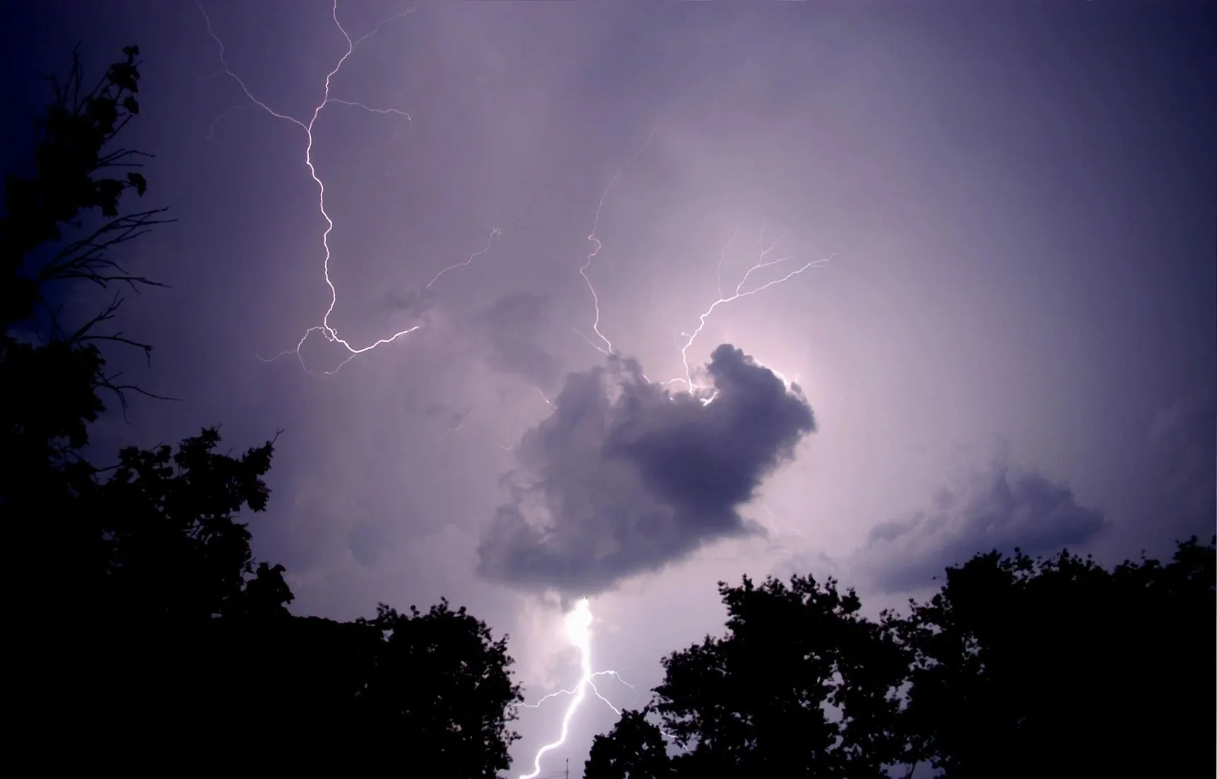 A cloud and lightning in the sky