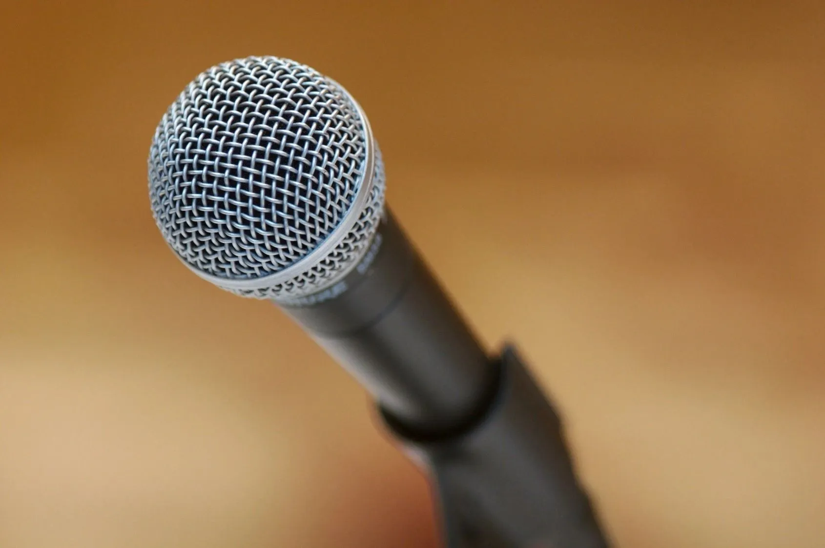 A microphone is shown with the reflection of it.