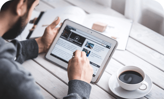 A person is using a tablet on the table